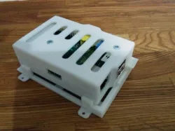Raspberry Pi case with click-on wall plate and slot for GPIO cable