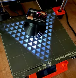 Triangle spherical projection with battery compartment, switch, and led