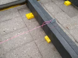 quick-adjust mason's cord anchor