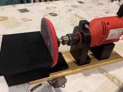 Drill clamp with sanding table attachment