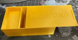 Box with sliding lid and hidden compartment