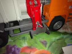 Bruder. spare part of the garbage truck container grab with side loading