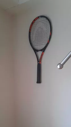 Tennis racket wall holder