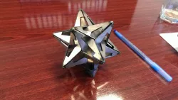 Gravitation (M. C. Escher) sheetmetal small stellated dodecahedron