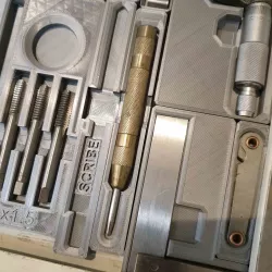 Center punch drawer bracket