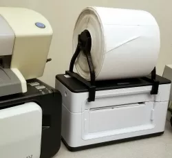 Thermal printer roll holder