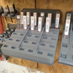 Wall mounted bracket for small tooling in packaging (rectangular cross-section)