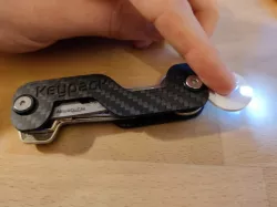 World's thinnest keychain flashlight (and shopping cart coin)