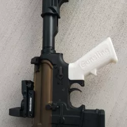 AR-15 pistol grip functional added spring hole.