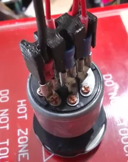 spade terminal array strain relief housing