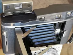 Polaroid roll film camera viewfinder mount 