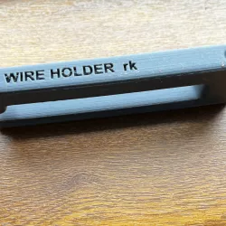 Under table wire holder