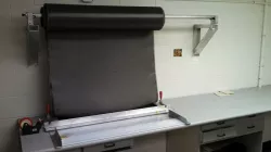 Fabric Cutting Fixture, Roll Dispenser and Fixture
