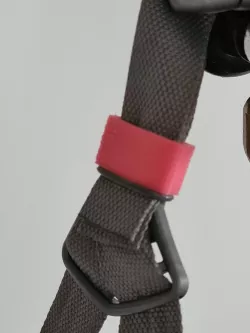 Bicycle helmet strap holder
