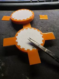 Tire with extra bed adhesive flap for TPU printing