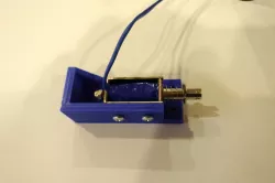 Bracket to mount solenoid for Virtual pinball machine force feedback.