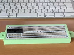 Mount for a full size Perma Proto Board on an 8020 Series 10 extrusion