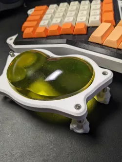 Ergonomic keyboard wrist rest tilt adjustment