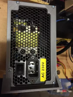 ATX power supply cutout, screw down mounting bracket