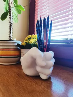 Fist pen cup
