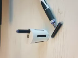 Fountain pen cartridge dispenser box. Revolver drum-like storage box for ink pen cartridges