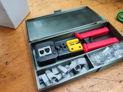 Box for RJ45 crimping tool.