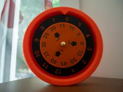 Reverse logic clock with rotating dial and fixed hand
