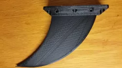 Skeg fin for Deflecting Debris around a hull mounted Bluerobotics T100 or T200 Thruster