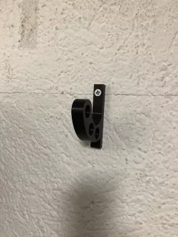 Wall mounted motorcycle helmet holder