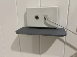 Electrical outlet shelf