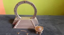 Stargate in an off-world pedestal with a DHD