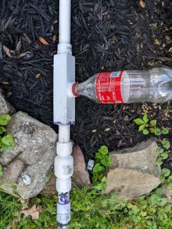 3/4 inch PVC coupler with 2 liter soda fitting