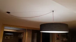 Electric wire cover and suspension for a dining room chandelier