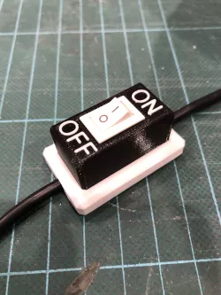 Snap-on rocker switch holder on cable