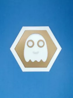 Hexagonal ghost Pacman inspired tile coin logo