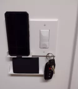 Wall switch/outlet plate that also holds your phone
