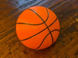 Basketball with inset filament