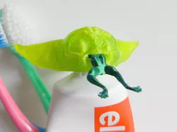 There goes Yoyo aka baby Yoda's lunch (toothpaste plug)