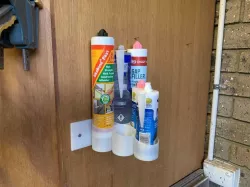 Caulk tube holder - wall mounted and free standing (plus test ring) 