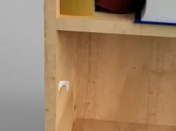 Shelf peg hole cable guide