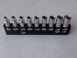 Modular ratchet socket holder for 1/4" square sockets. Replaceable springs.