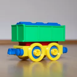 Toy train cargo car construction set.