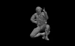 NATO SOLDIER CROUCHING DOWN INDICATING