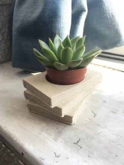 Book pile plant pot