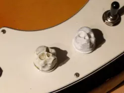 Skull button guitar