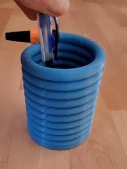 Water hose as pen holder in spiral shape