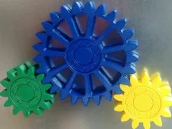 Gears with embedded magnets and integral bearing