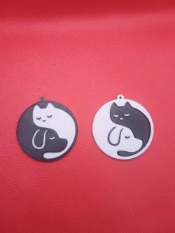 Yin yang keychain in the shape of cat and dog