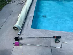 Roller support for pool cover crank handle