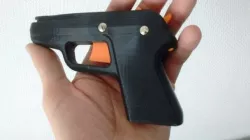 Compact rubber band gun